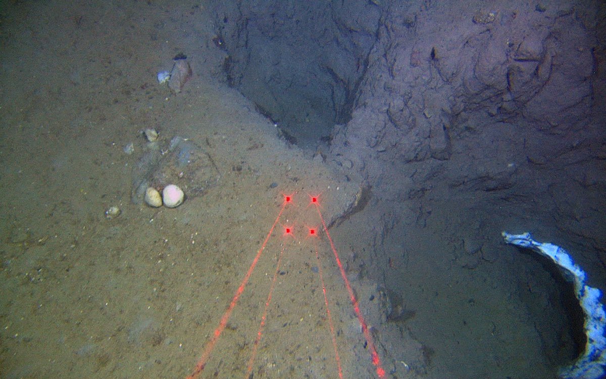underwater photo of seabed with laser marks